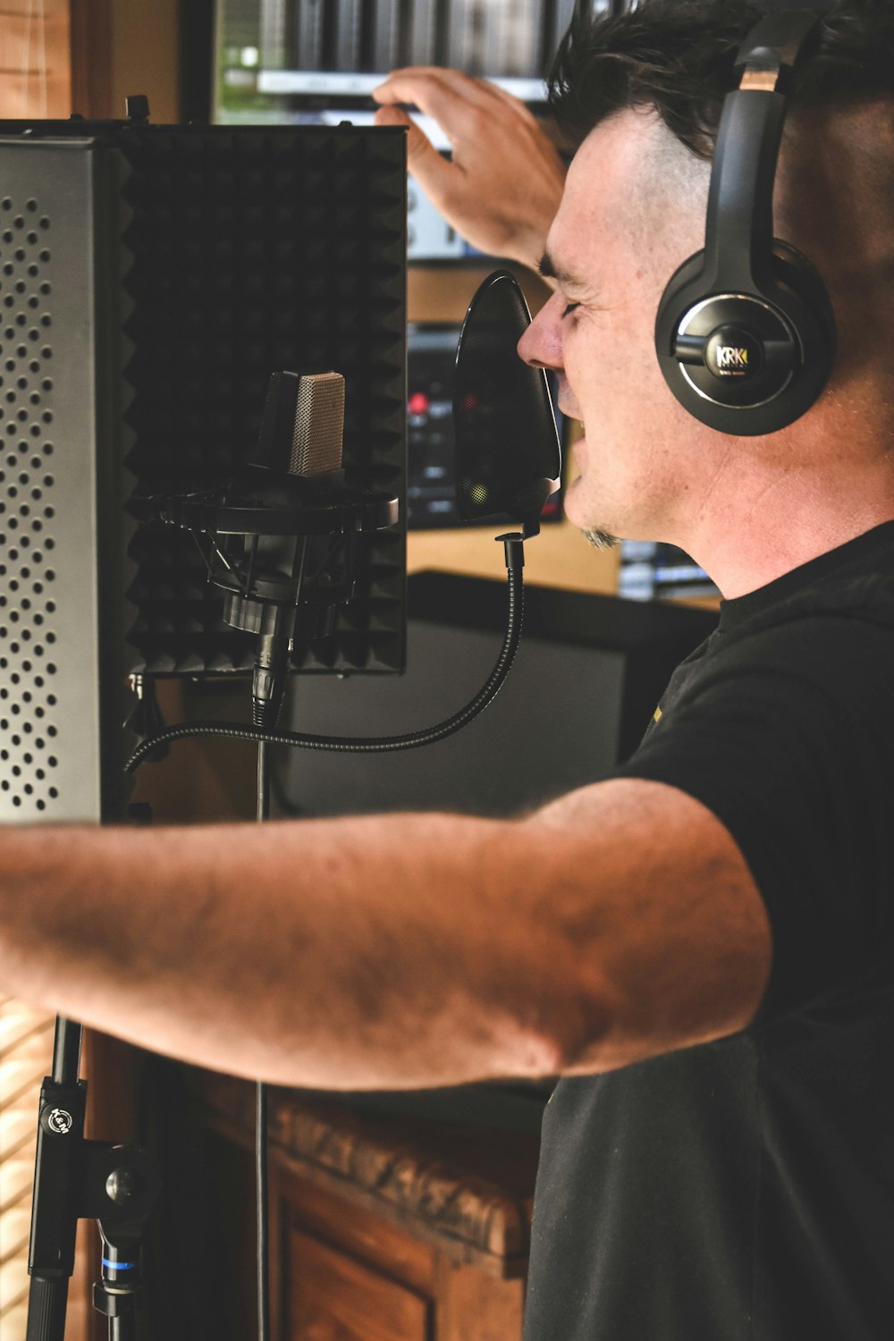 man in black t-shirt wearing black headphones