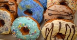 A colorful assortment of mini donuts on a table.
