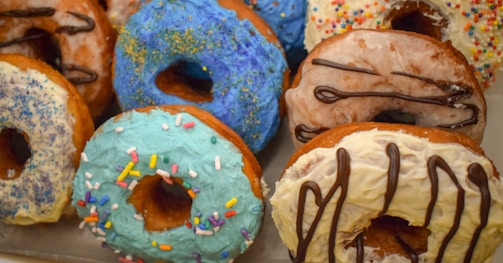 A colorful assortment of mini donuts on a table.