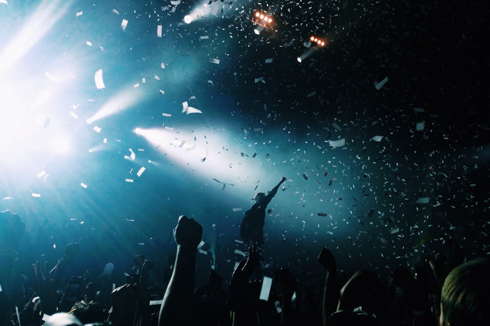 silhouette of people watching a concert