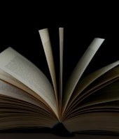 white book page with black background