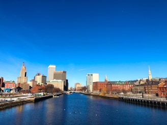 city skyline under blue sky during daytime