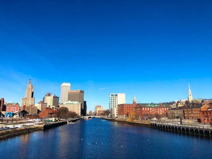 city skyline under blue sky during daytime