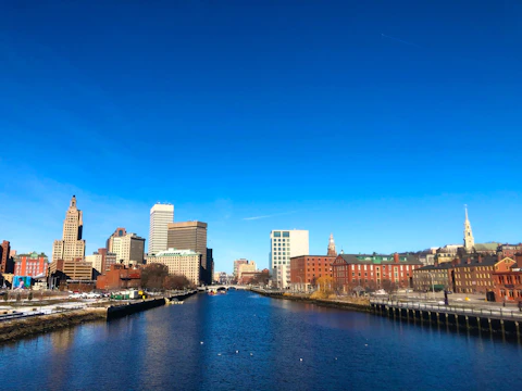 An engineer reviewing blueprints for a sustainable urban infrastructure project under bright daylight.