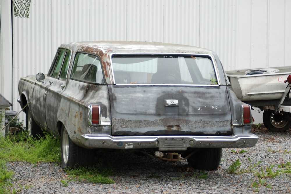 gray station wagon on green grass field during daytime