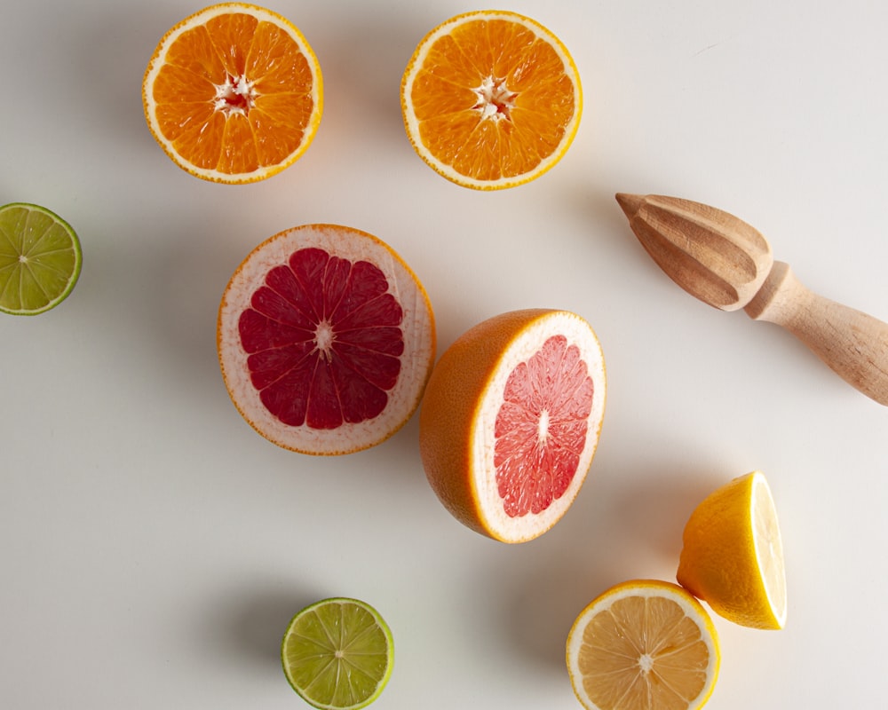 sliced orange fruit on white surface