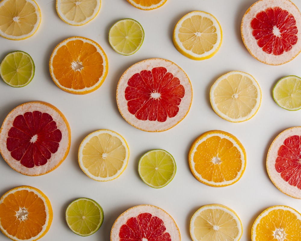 sliced orange fruit on white surface