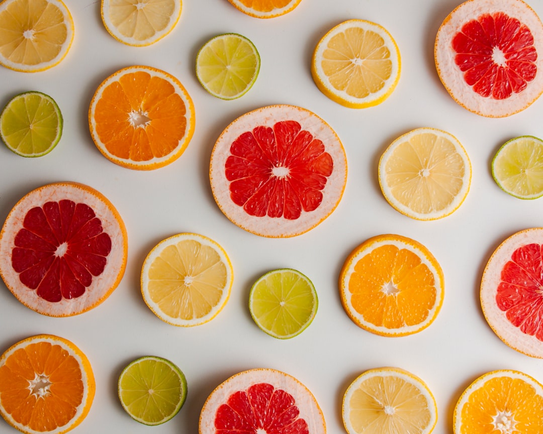 sliced orange fruit on white surface