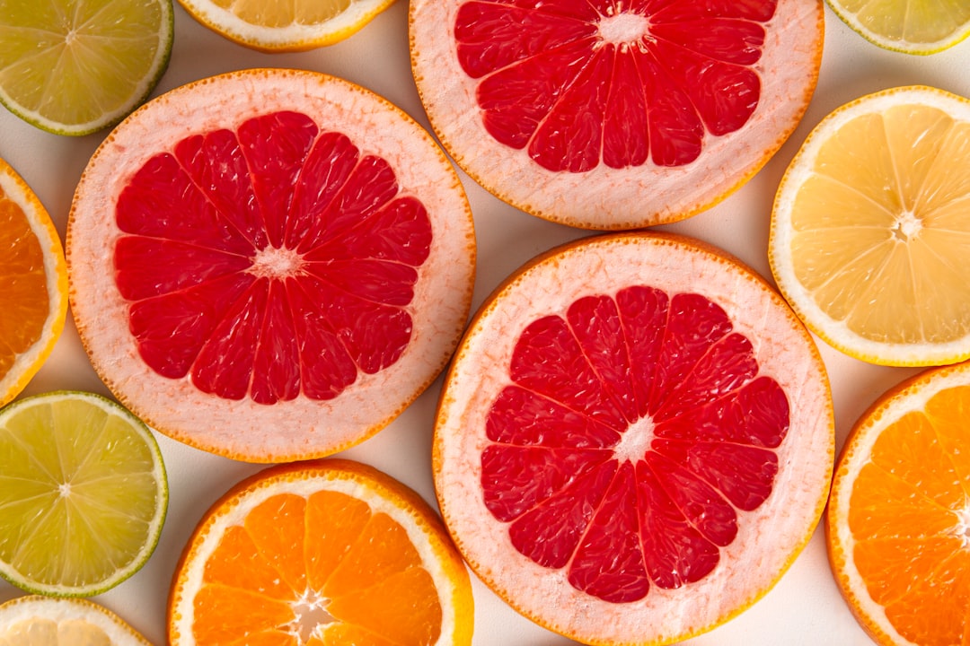 sliced orange fruits on white surface