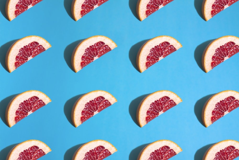 sliced watermelon on blue surface