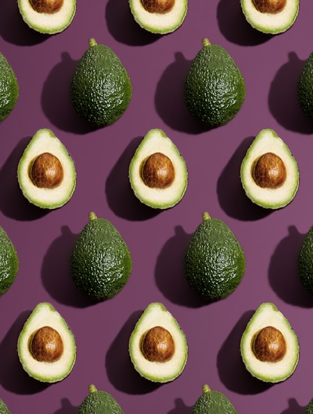 sliced green fruit on purple background