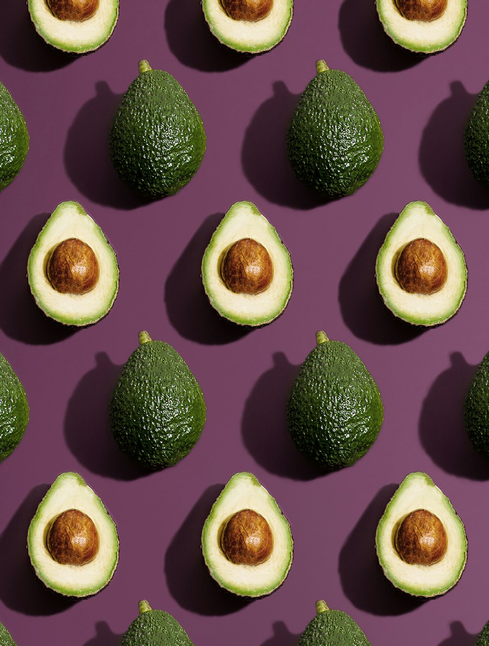 sliced green fruit on purple background