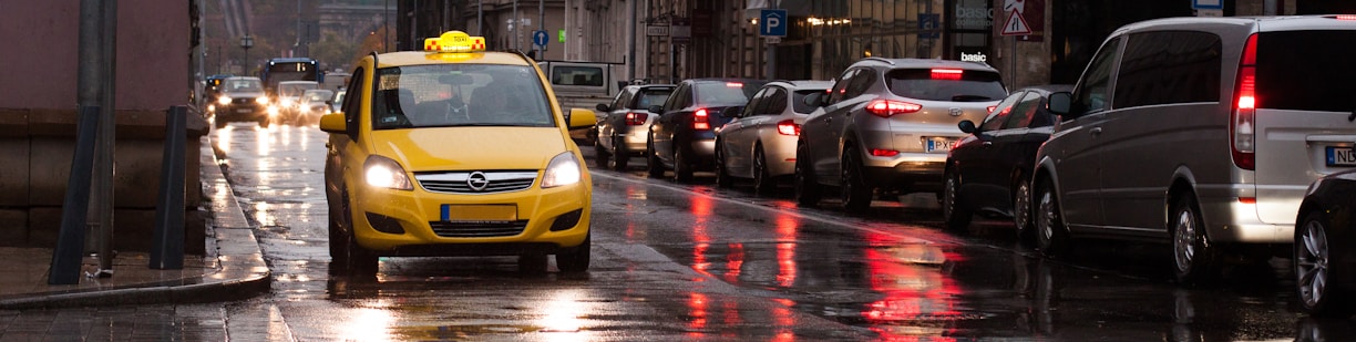 yellow car on road during daytime