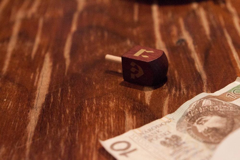 10 banknote on brown wooden table
