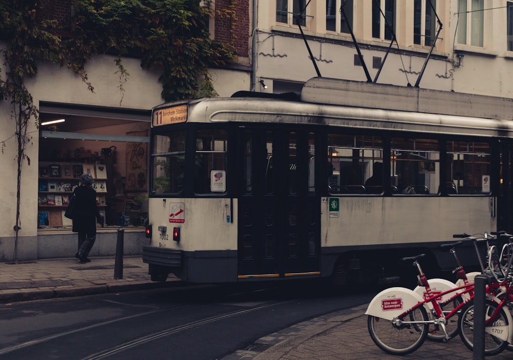 white and black bus on road during daytime