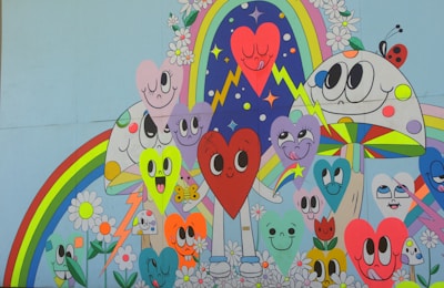 A colorful mural painted by community members depicting hearts and stars intertwined.