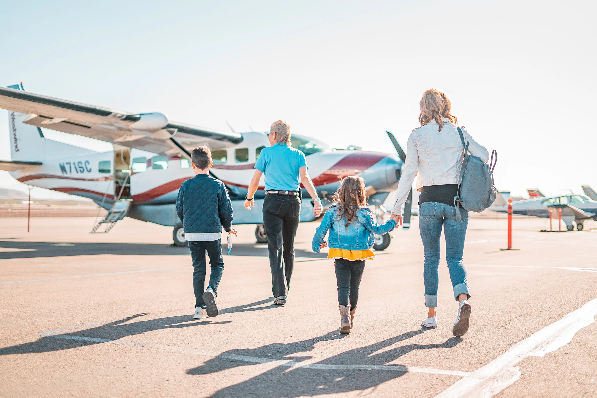A family walking together towards their flight