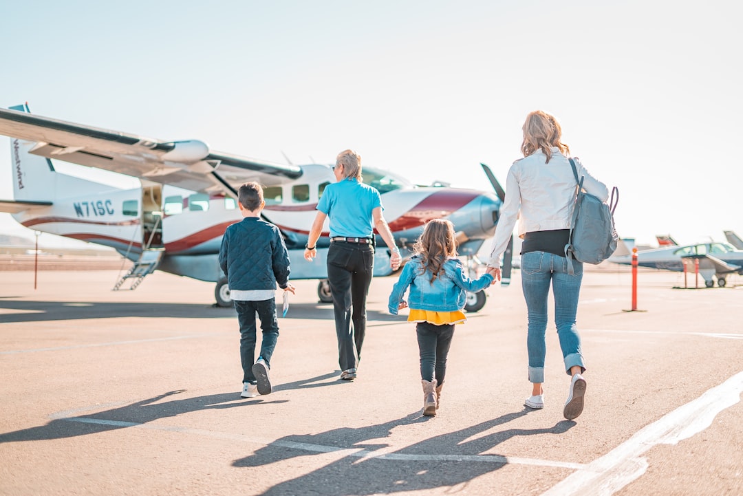 woman in blue denim jacket walking with girl in blue jacket, Grand Canyon Air Tours with Westwind Air Service