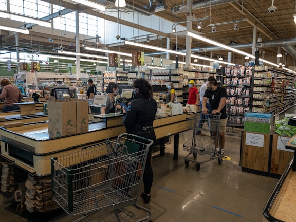 Wide view of the supermarket interior bustling with customers