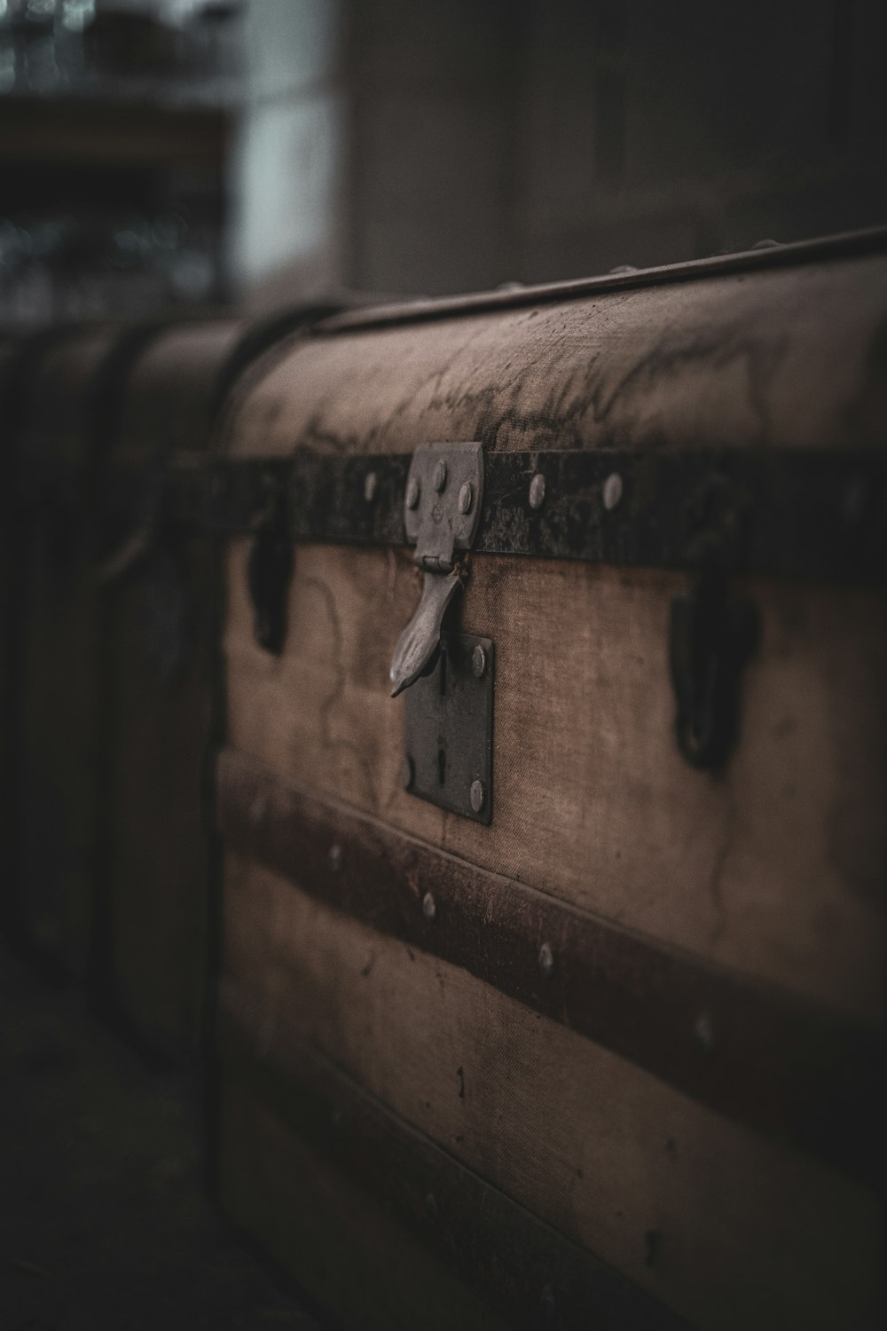 brown and black suitcase in close up photography