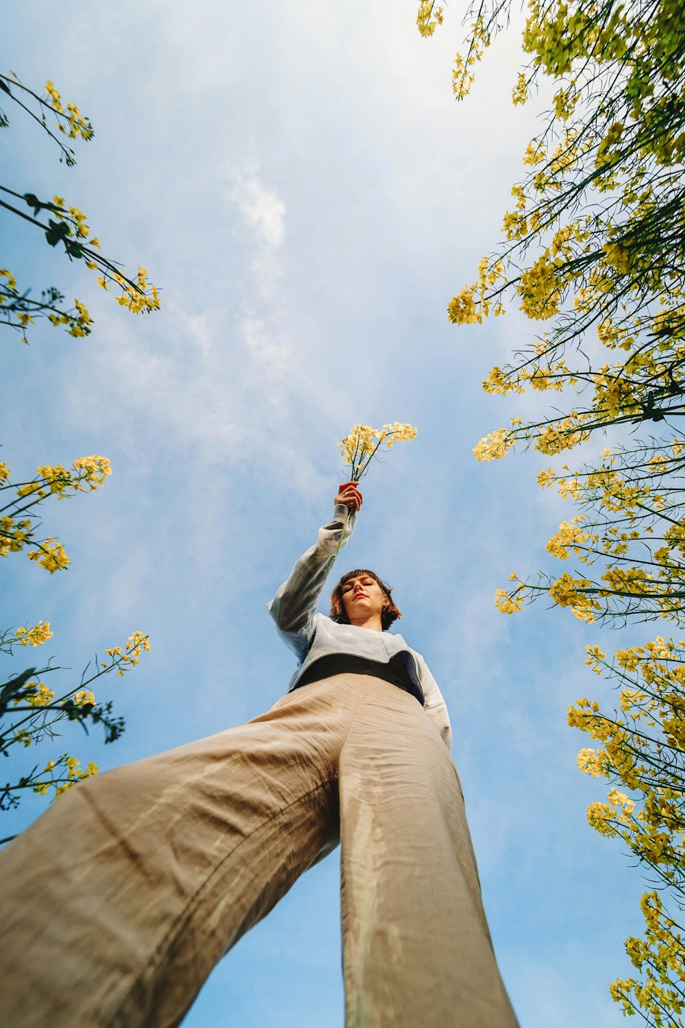 woman under white clouds during daytime