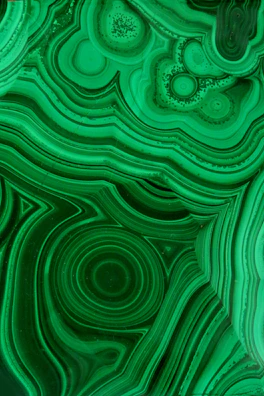 Vibrant malachite patterns with a sleek metallic sheen overlay.