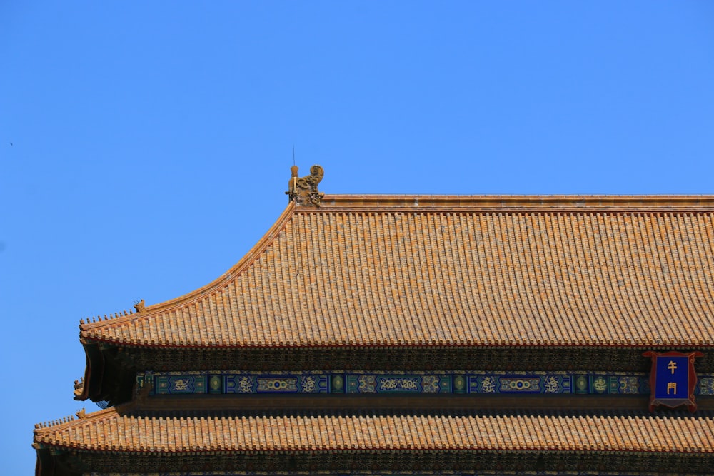 brown and black roof under blue sky during daytime