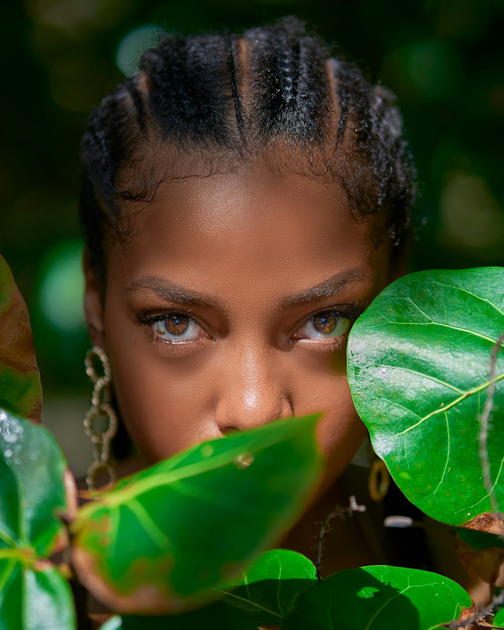 girls face on green leaves