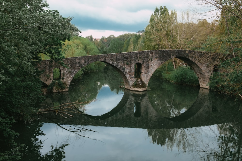 gray concrete bridge over river