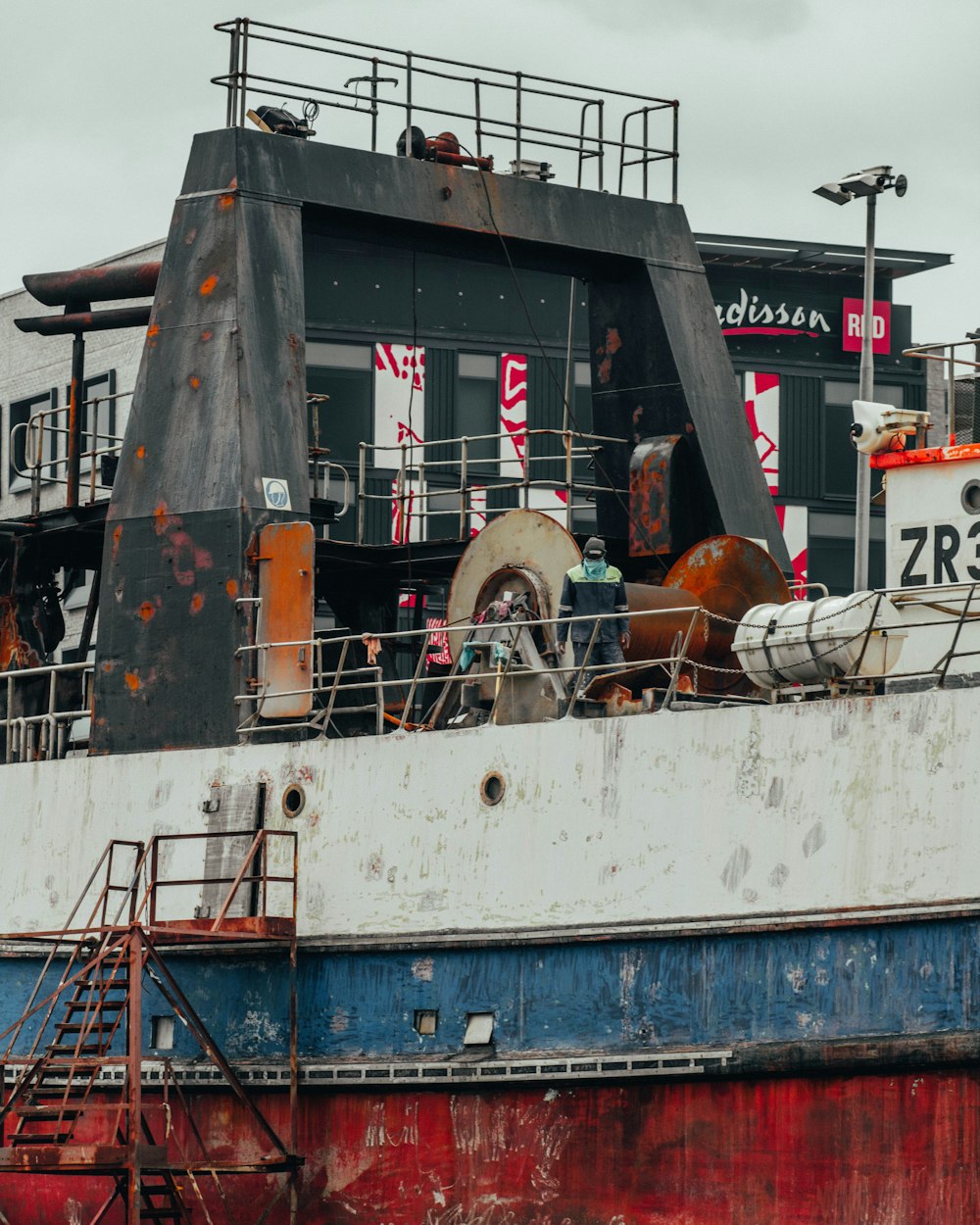 white and red ship on sea during daytime