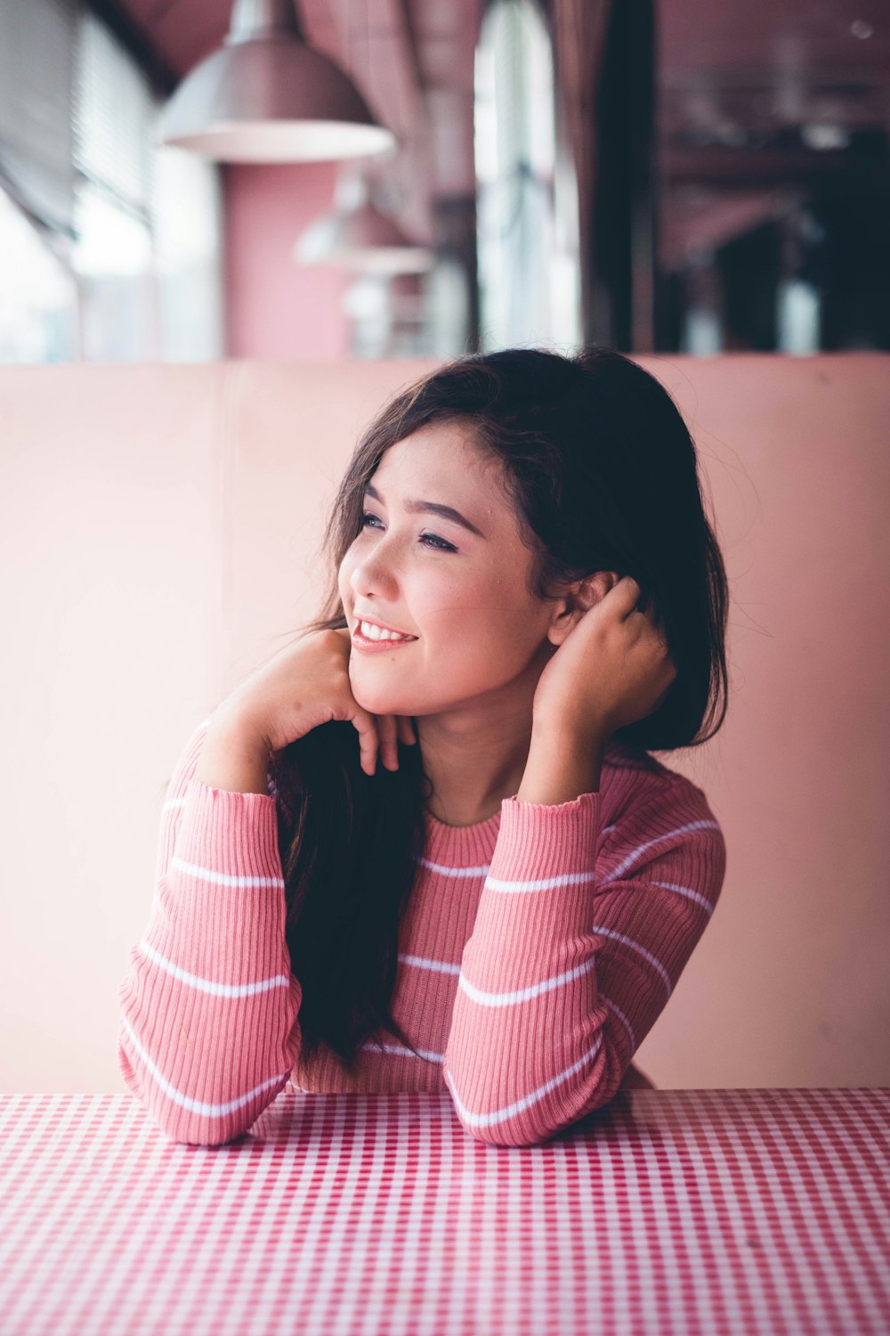 girl in red and white striped long sleeve shirt