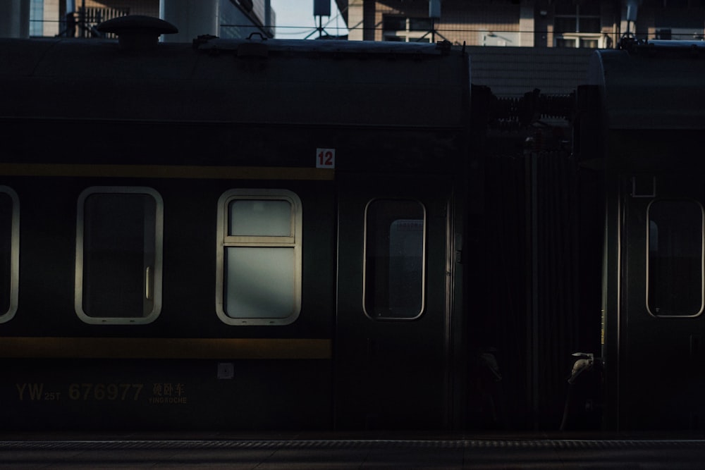 black and white train on rail during daytime