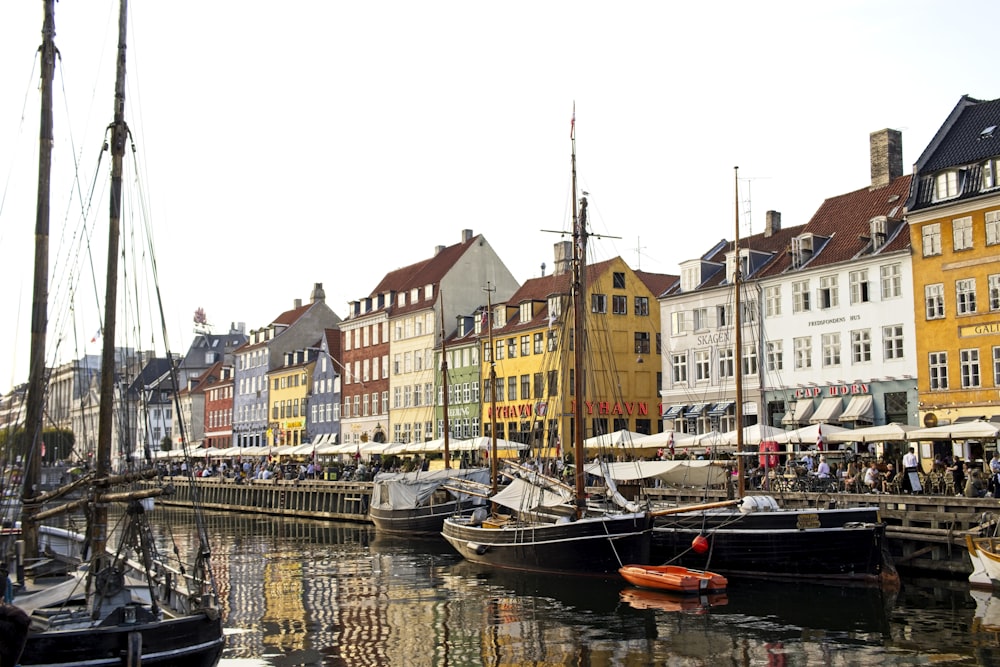 boat on water near buildings during daytime