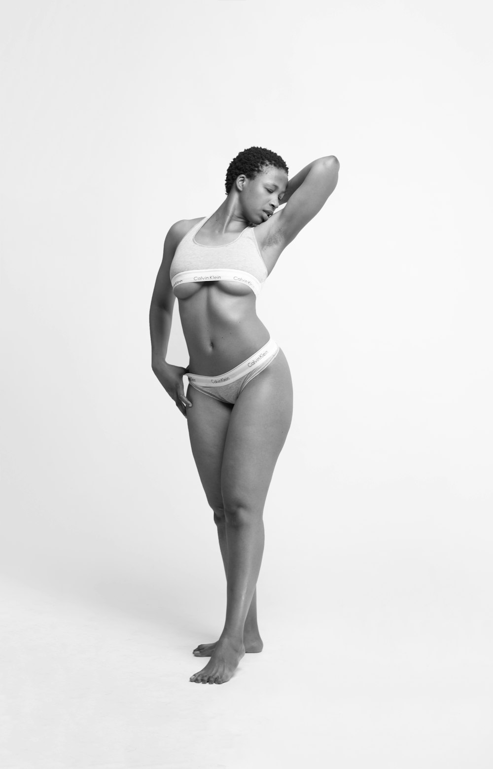 woman in white bikini bottom