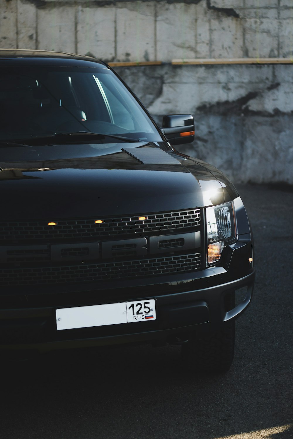 black chevrolet car on road during daytime