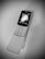 A black and white image of a nostalgic flip phone placed on a textured surface. The phone is open, revealing a keypad with numeric and function keys. The screen shows a digital clock display.