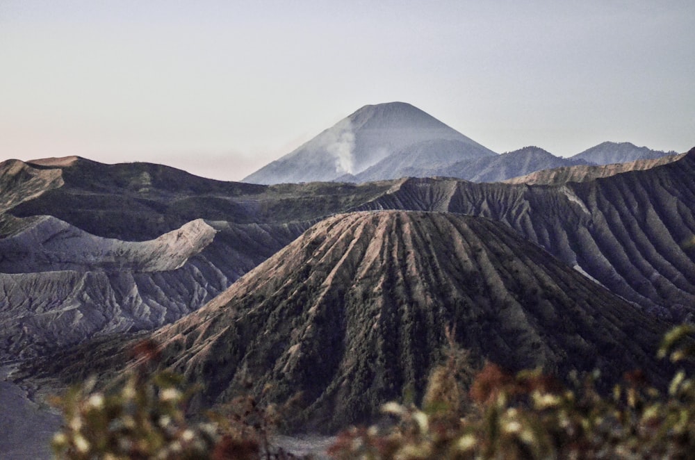 brown and green mountain under white sky during daytime