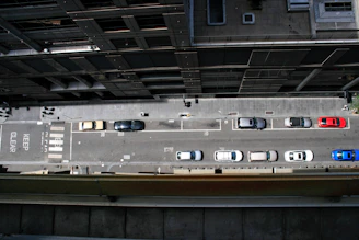 An instructor demonstrating parallel parking on a busy Luton street.