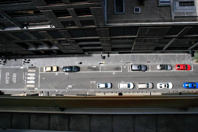 An instructor demonstrating parallel parking on a busy Luton street.