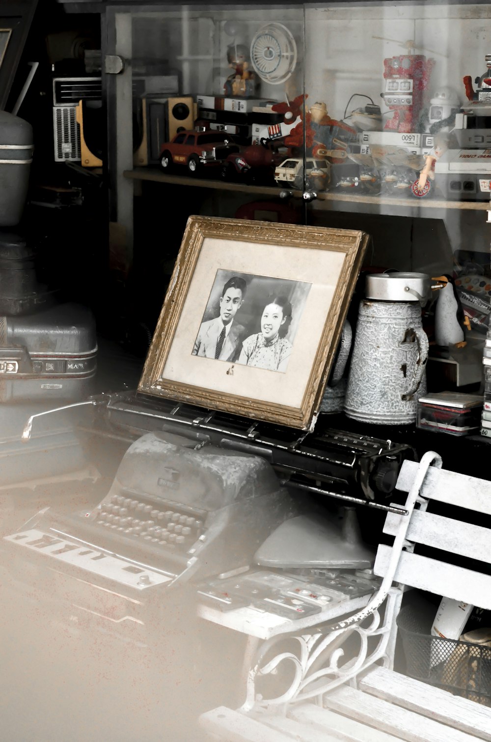 brown wooden framed picture on white plastic table