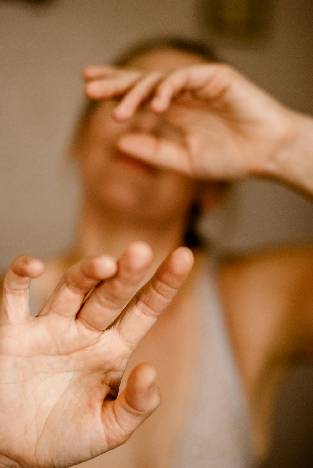 person holding face of woman