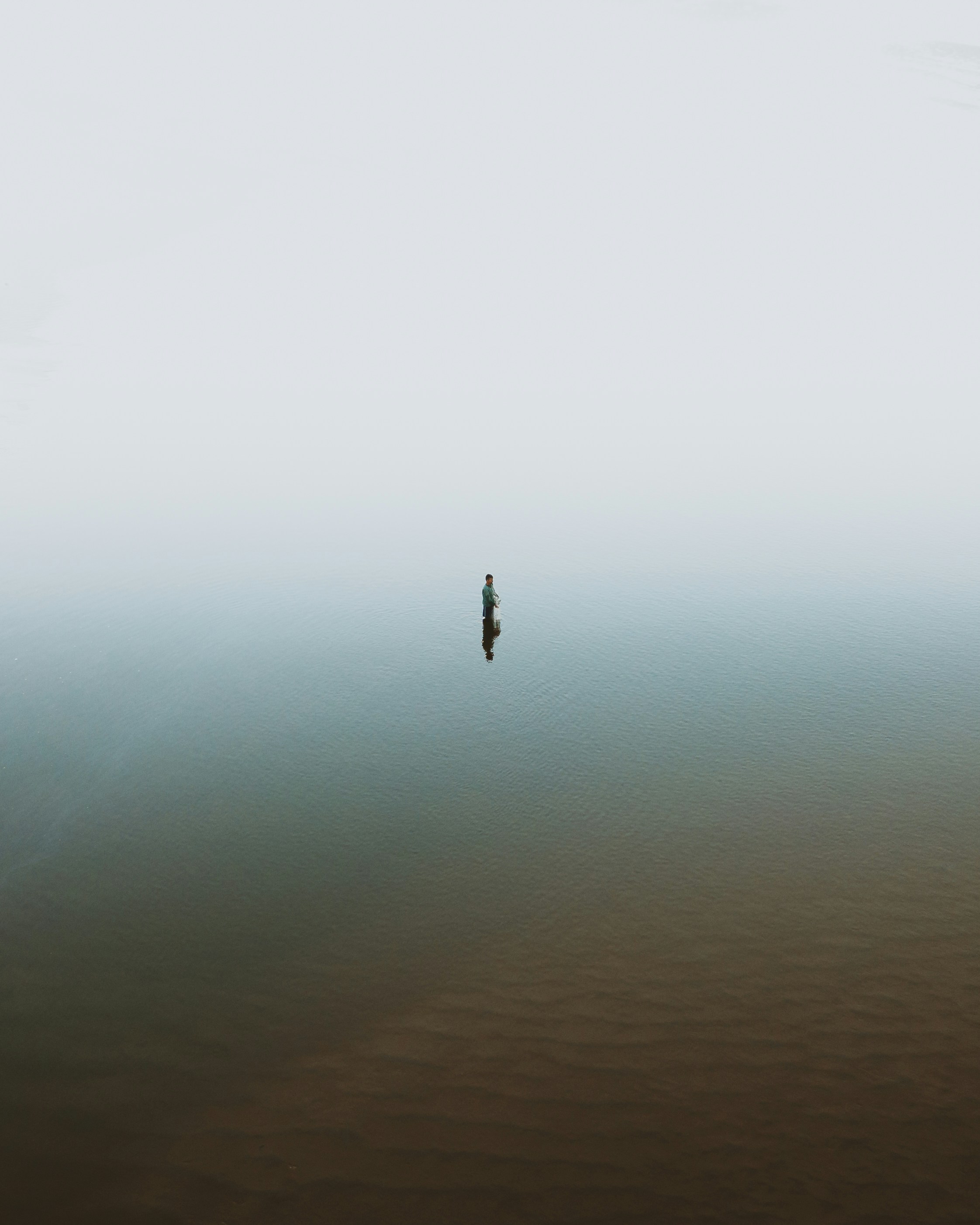 person in body of water during daytime