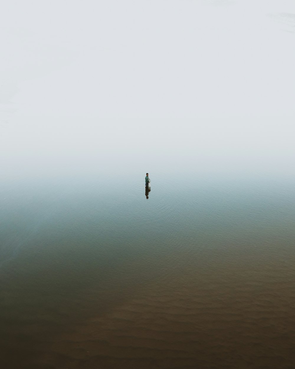 person in body of water during daytime