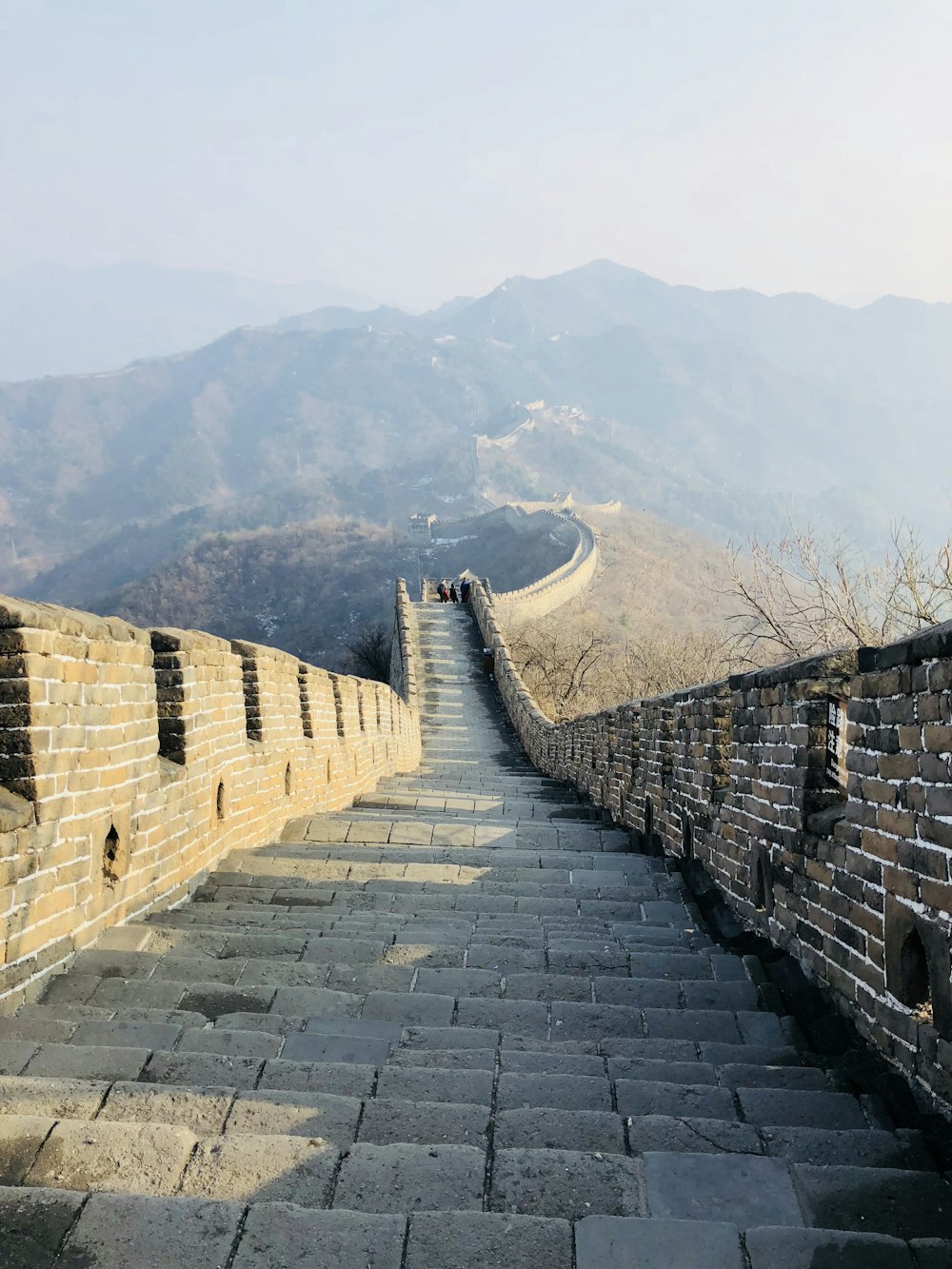 brown brick wall on mountain during daytime