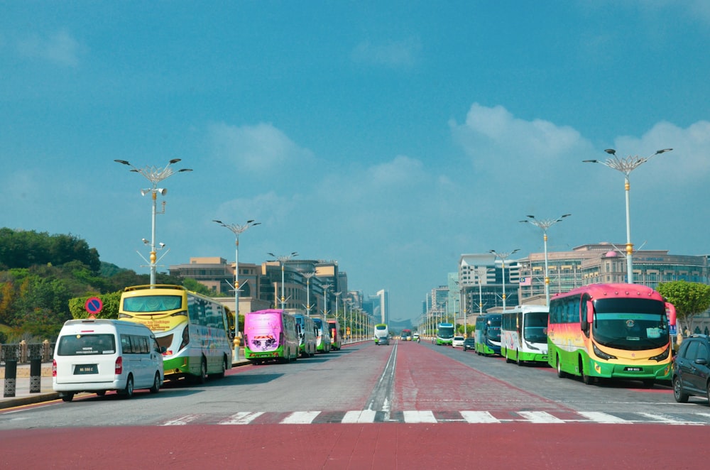 cars on road near city buildings during daytime
