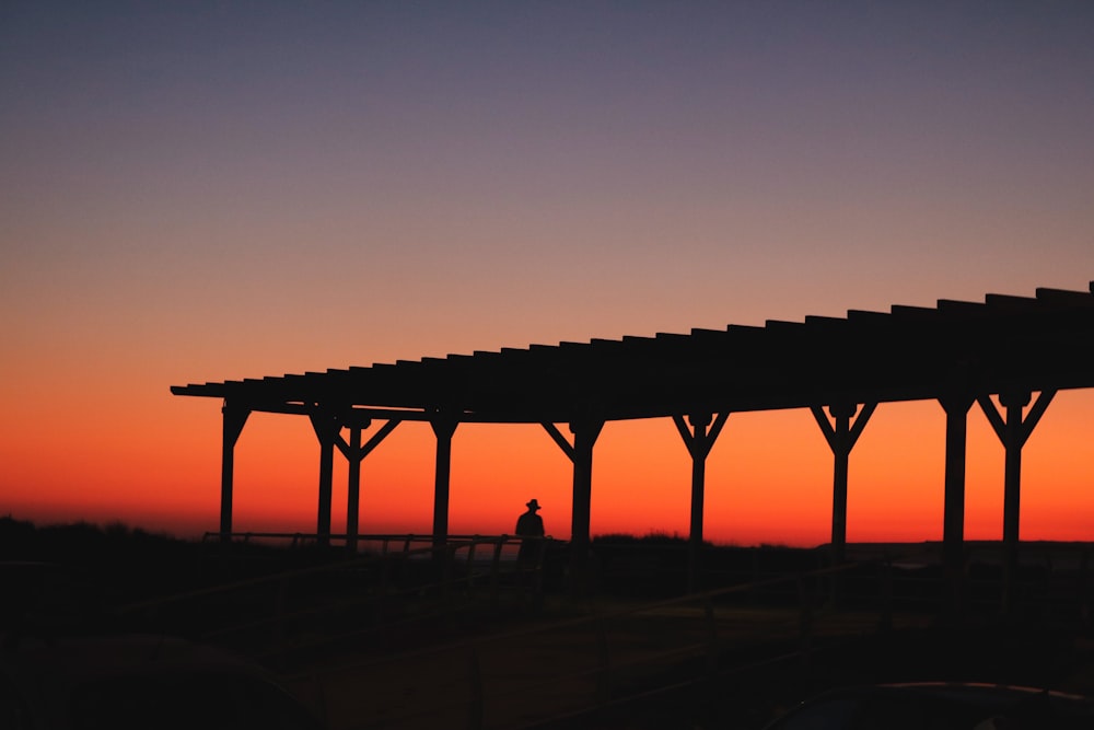 silhouette of bridge during sunset