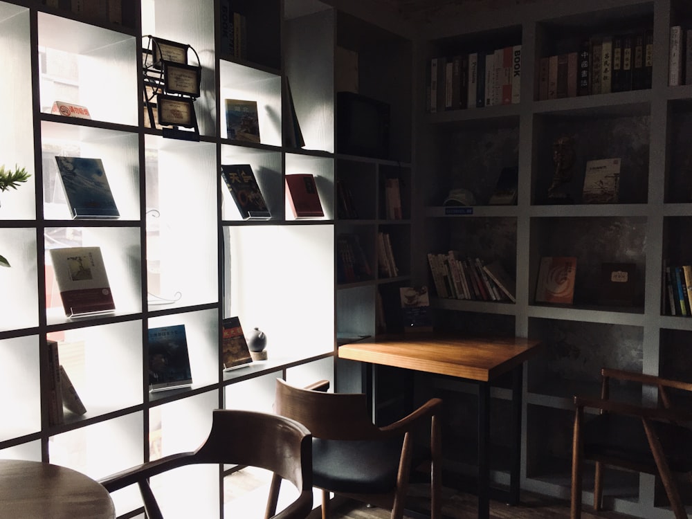 brown wooden chair near white wooden shelf