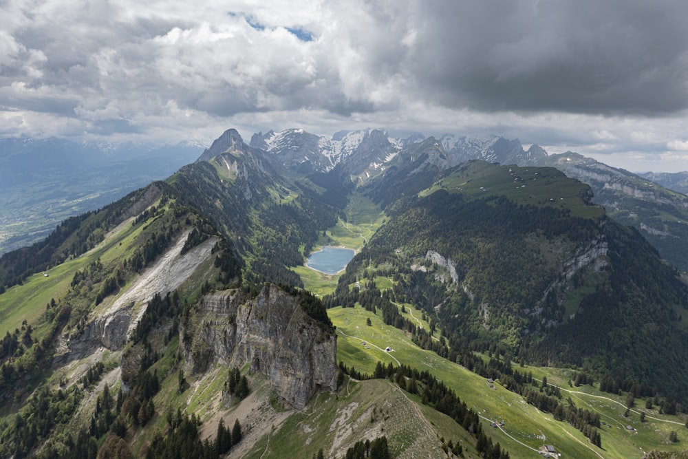 green mountains under white clouds during daytime