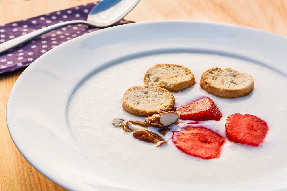 sliced strawberries on white ceramic plate