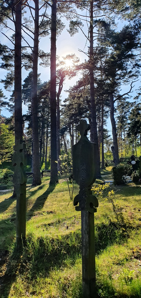 man in black suit statue in Nida Lithuania